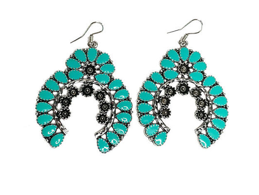 Western look drop circle earrings set in silver with turquoise and floral treatments.