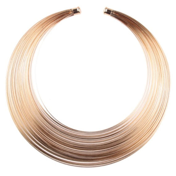 Women's gold choker with multi ring design. Metal alloy.